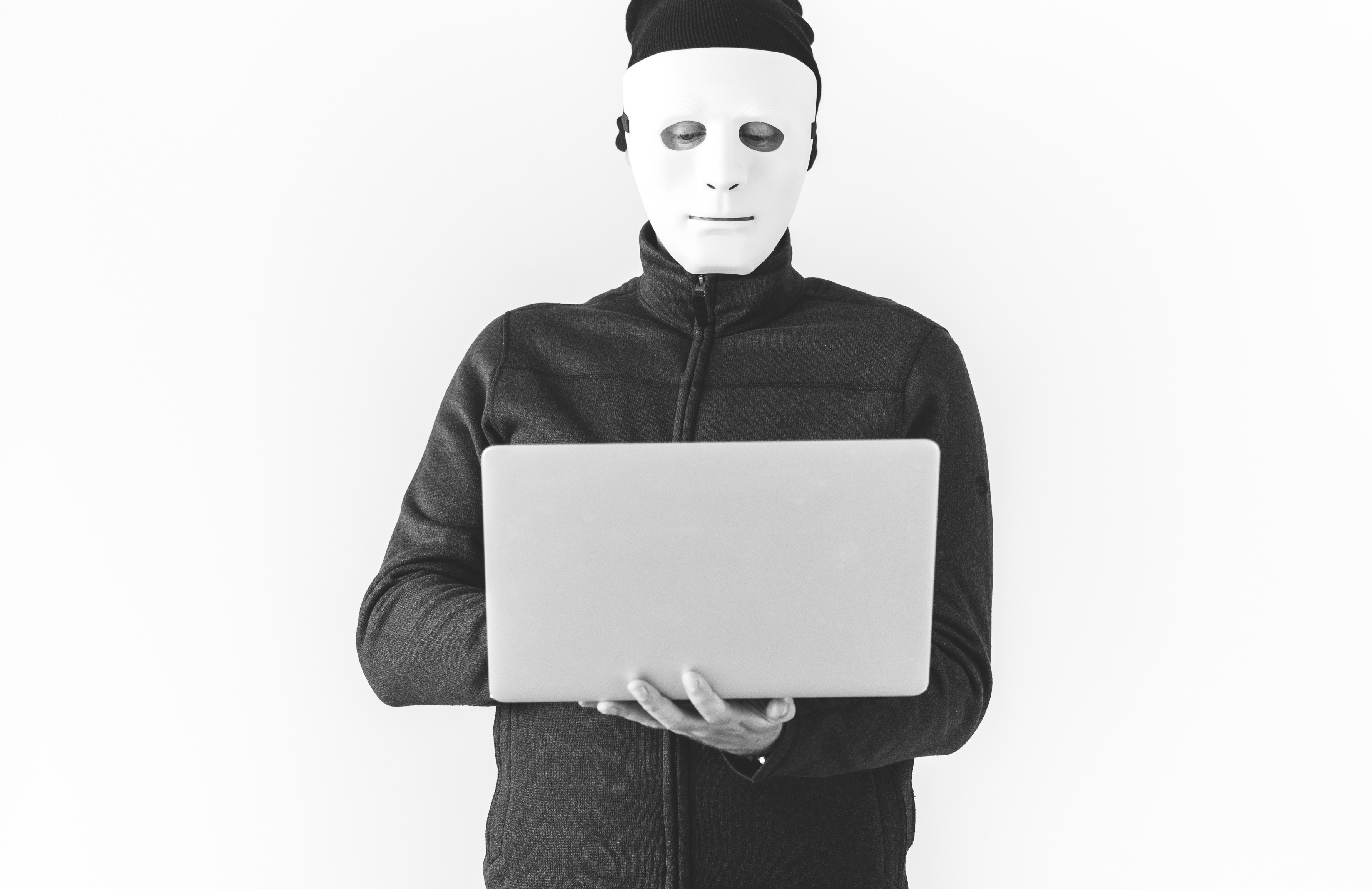 Masked man on laptop